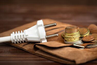 Electrical,Plug,With,A,Wallet,And,Euro,Money,Coins.,Saving